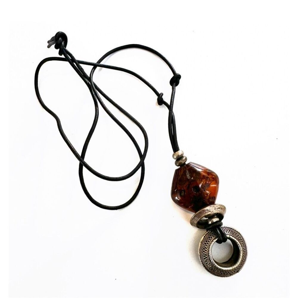 Brown and silver pendant necklace on cord